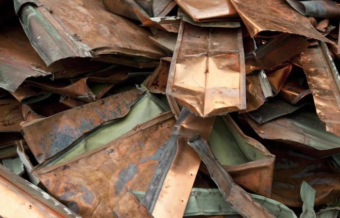 Scrap copper sheets and pipes collected for recycling