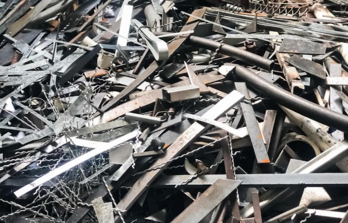 Stack of scrap aluminum pieces and metal sheets for recycling